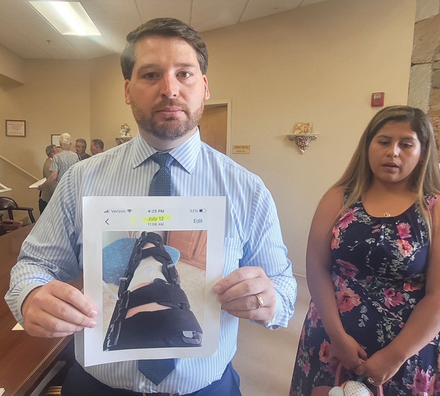 AILING MOM: Dennis Cardillo Jr. holds a photograph of what he says is his mother’s post-operative injury dated July 12. The candidate for state representative in District 42 has been accused of living outside the district. He insists he was merely taking care of his mother in Cranston while she recuperated.